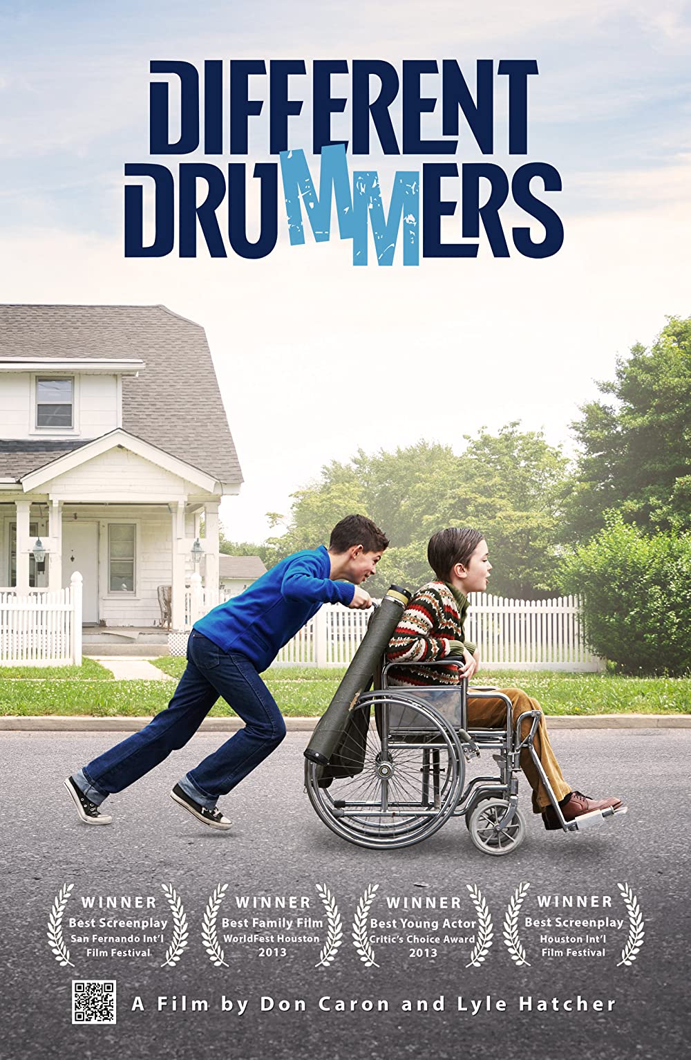 DVD Cover of Different Drummers, featuring Lyle putting maximum effort into pushing David's manual wheelchair